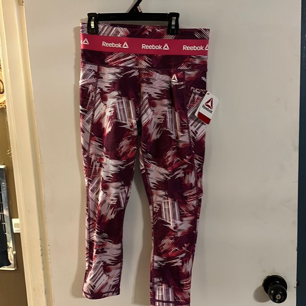 Reebok pink, and purple capri leggings size medium new with tags.